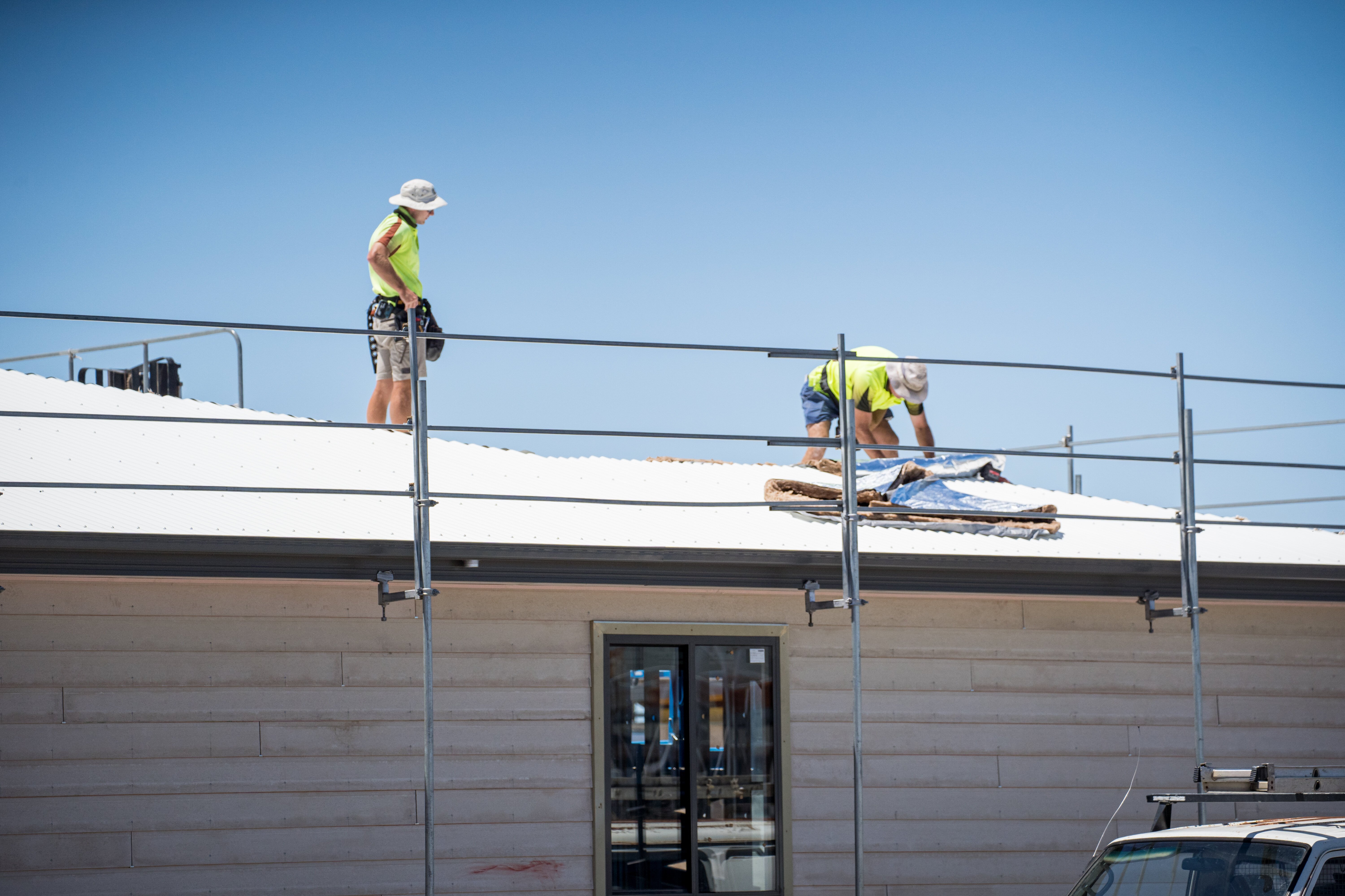 Trades completing a roof