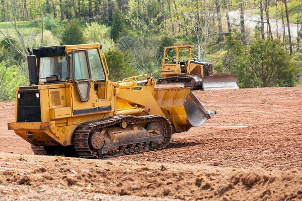 Large Earth Mover Digger Clearing Land