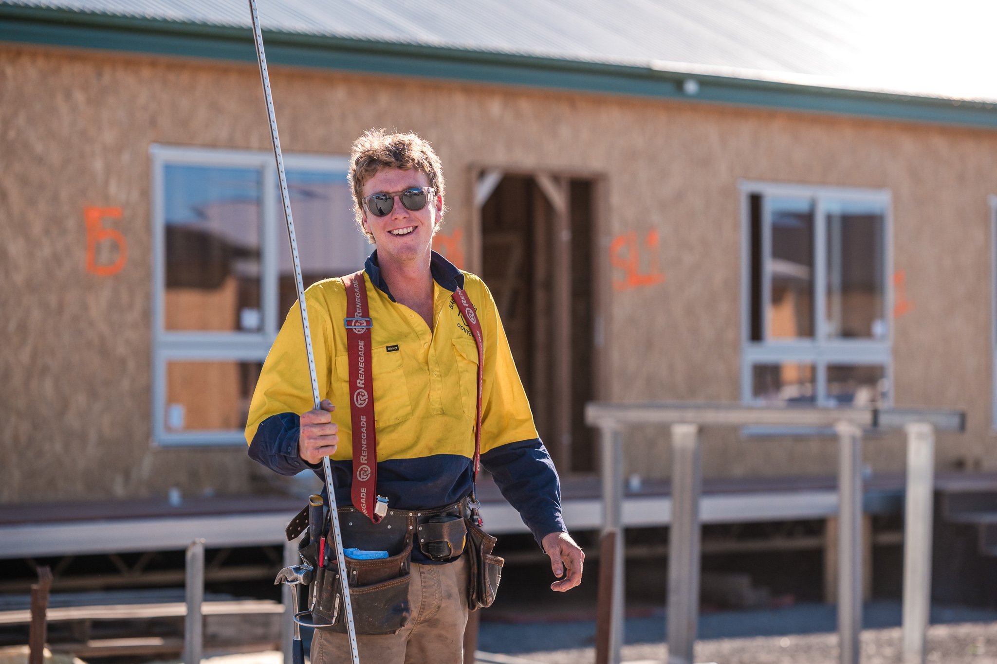 Smiling builder on construction site