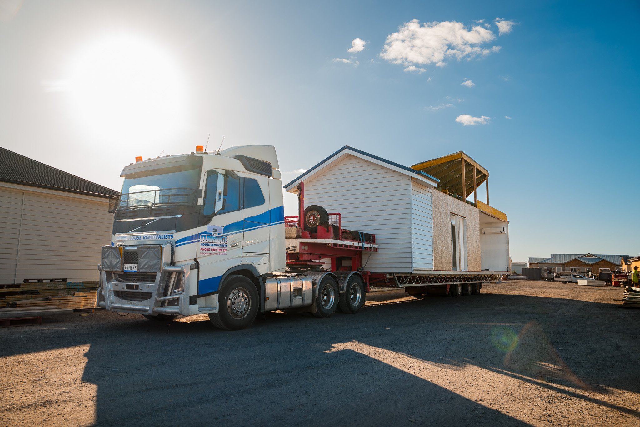 Modular home being transported on truck