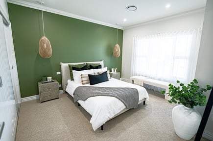 Bedroom with green feature wall