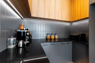 walk-in pantry with black tiles